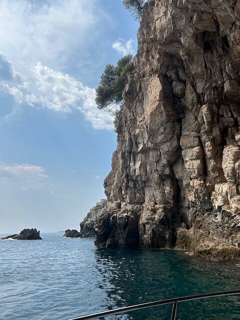 Dramatic limestone sea cliffs seen from the boat near Dubrovnik